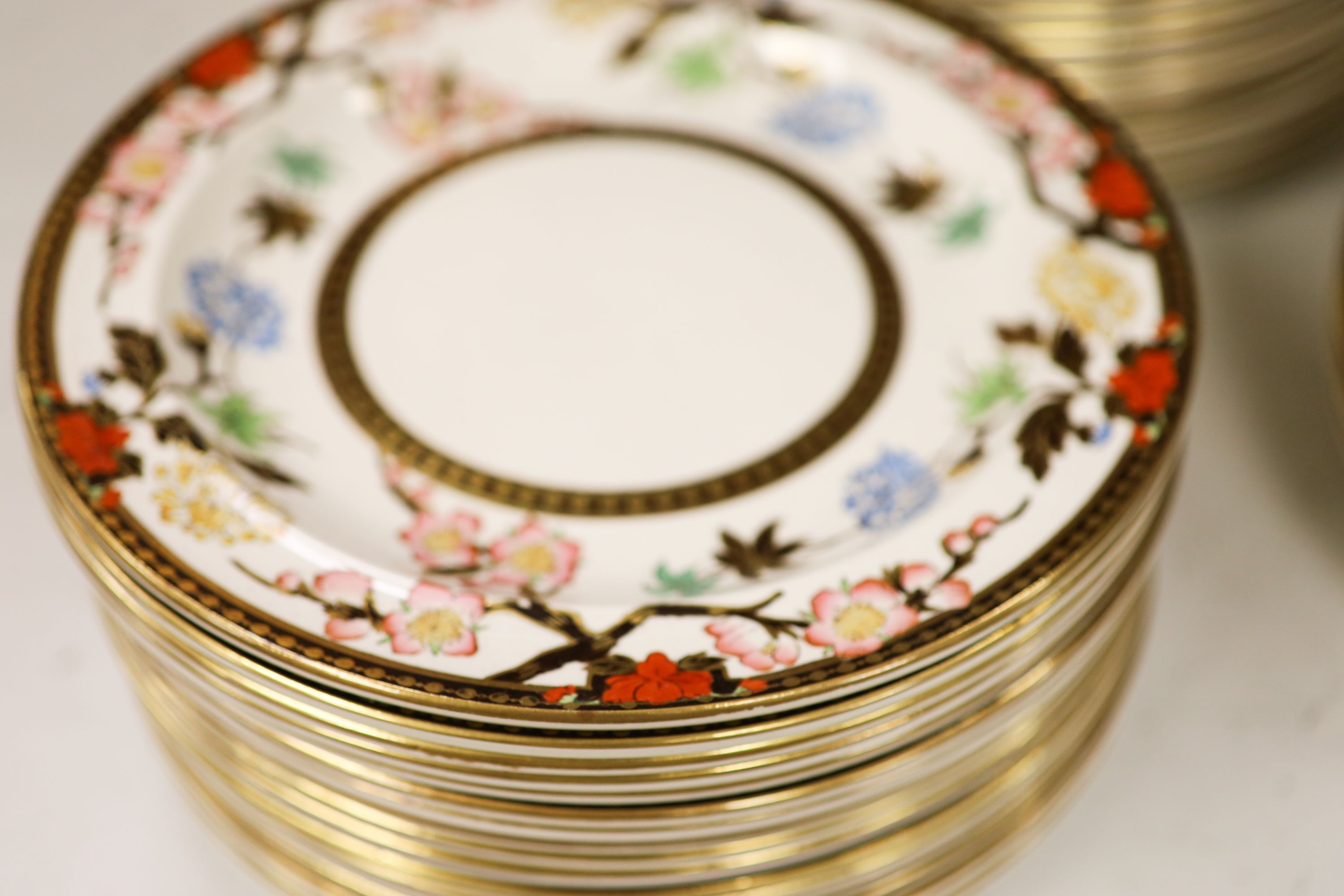 A Wedgwood Crescent pattern creamware part dinner service, the borders decorated with pink blossoms and chrysanthemums (approx. 65 pieces)